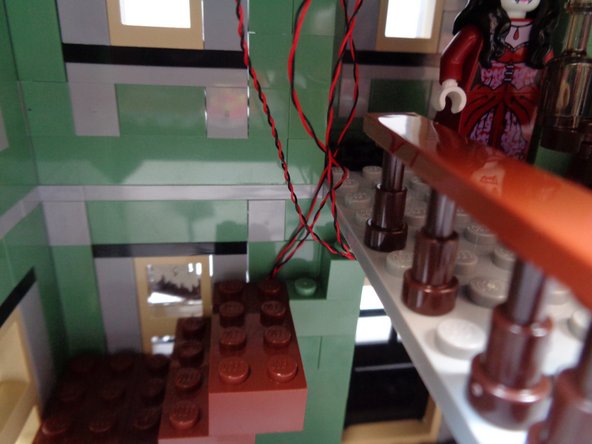 As shown by the photos in this step, re-attach the remaining three brown 2x4 LEGO® bricks to complete the staircase.