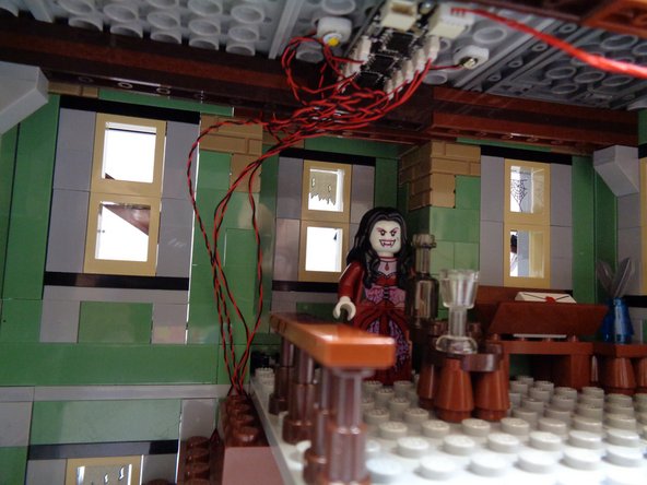 As shown in the photo, you should now have all sections of the stairs re-attached and all excess wires should be coiled up near the BRANCH09X adapter board.