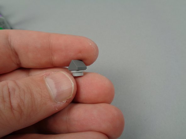 As shown in the first two photos for this step, take two parts from the spares from your original LEGO set and create an angled mount for the second yellow LED light.