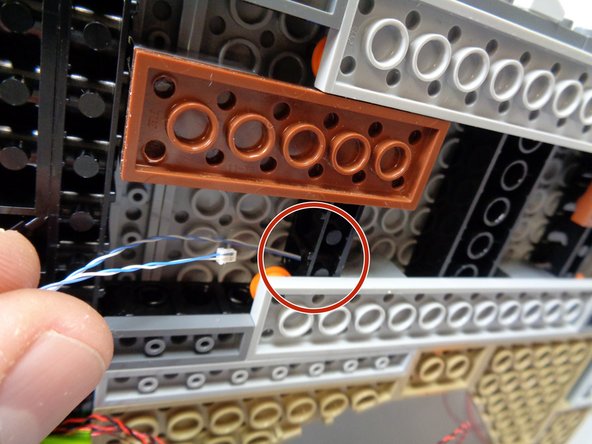 Remove the large triangle plate as shown in the second photo.