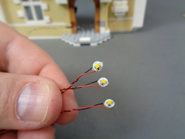 Inside the &quot;Middle Level Lights and Parts&quot; bag, there are three warm white Pico LED lights with 12&quot;/30.4cm wires.  There are also small sticky squares inside the bag.