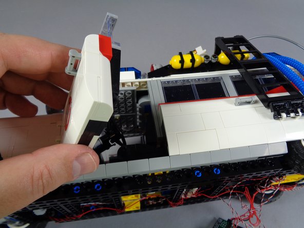 Carefully turn your Ecto-1 around so you can access the front door near the hood spot light.