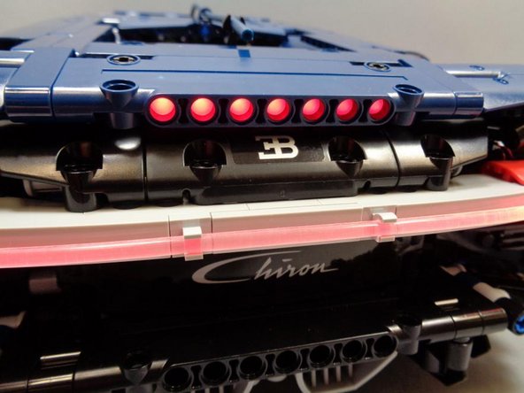 The pre-lit spoiler should still move up and down as freely as it did before you installed the LEDs.  Check to make sure you can still open and close the spoiler, and that it stays up when open.