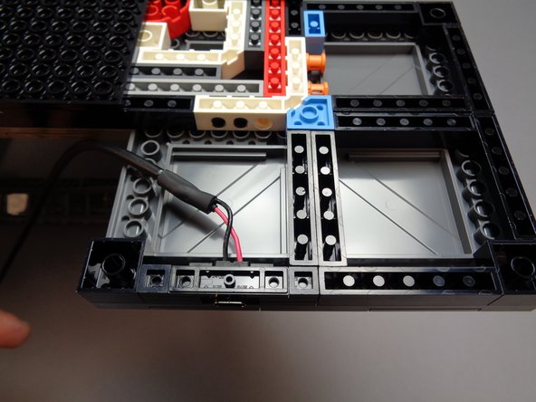 When placing the connector bracket, be careful not to press too hard and cause the top side of the tower frame to come loose.  It is a good idea to support the top side of the foot with one hand while pressing down on the bracket with your other hand.