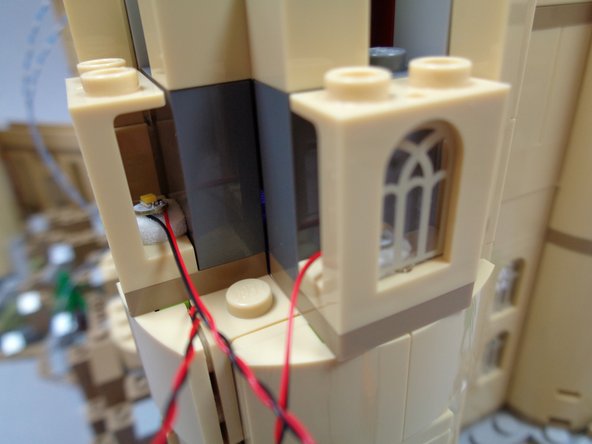 As shown in the third photo (red rectangle), carefully re-attach the slope parts above the lower window.