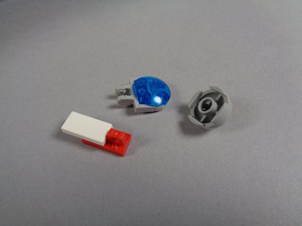 As shown in the first photo for this step, remove the hood spot light and its holding clip.