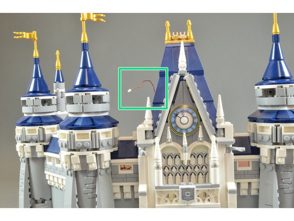 Re-attach the clock and roof section.  The clock LED light wire should stick out the back of the section behind the clock.