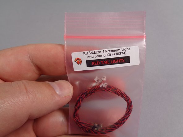 As shown in the first photo, there will be a small pink bag labeled &quot;RED TAIL LIGHTS&quot; inside the larger &quot;MAIN CHASSIS PARTS&quot; bag.  There will be six red Pico LED lights inside this bag.