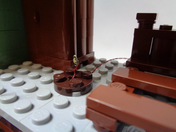 As shown in the second photo, take the small &quot;Red LED Bag&quot; out of Bag 2.  Remove the single red Pico LED light from the bag.