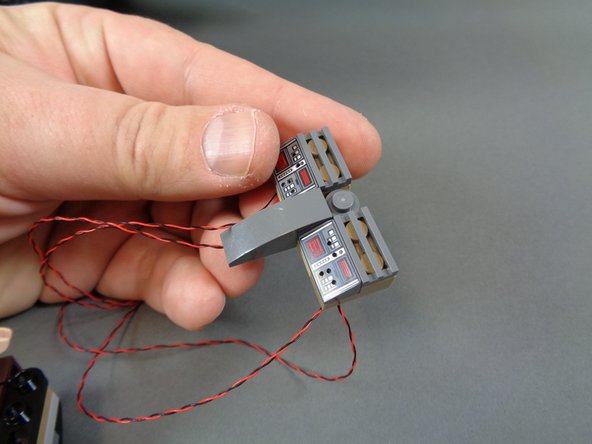 After re-assembly, your cockpit section should look like the cockpit in the third photo (although, maybe not with the minifigures!).