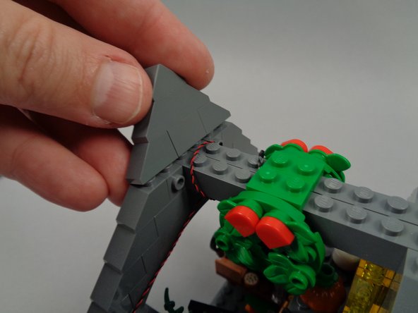 As shown in the photos for this step, re-assemble the rooftop section of Jack's house.