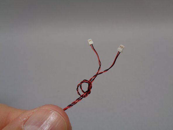As shown in the third photo, tie the ends of the wires for the two cool white lights together.  This will help identify them when you connect them in the next step.