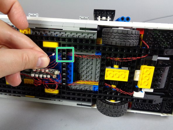 As shown by the orange arrow in the third photo for this step, connect the tail light wire to plug #9 on the BRANCH09X adapter.