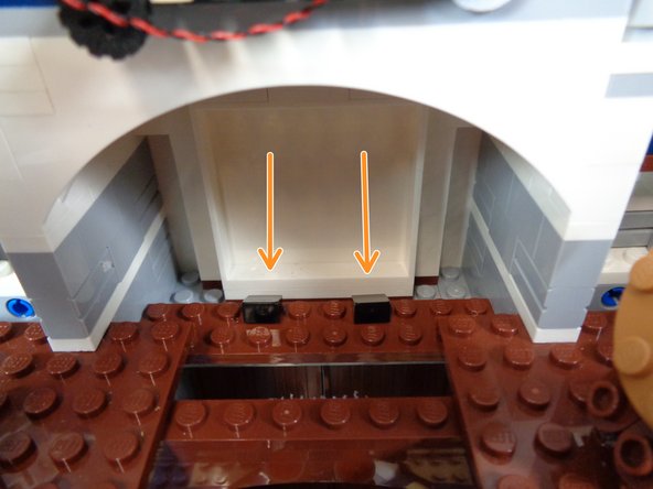 As shown in the second photo, connect one end of the black cable to one of the plugs on the light strip.