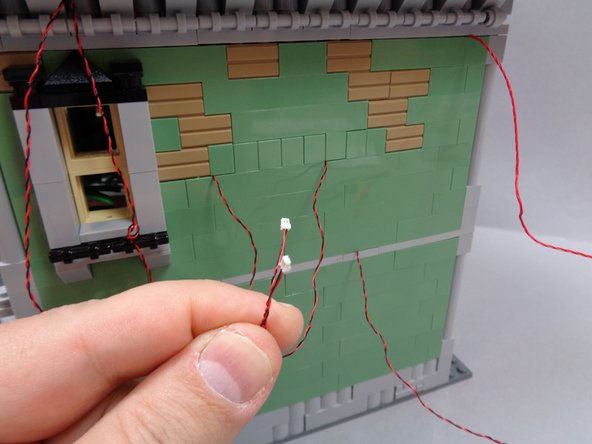 Take the two wall sconce light wires as shown in the second photo, and connect them to plugs #6 and #7 on the BRANCH09X adapter as shown by the green arrows in the third photo.