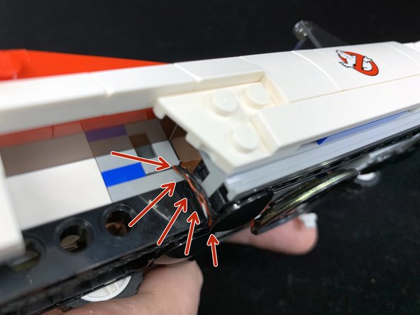 When re-attaching the part, make sure the three wires are pulled tight and that they run between the studs underneath the part.