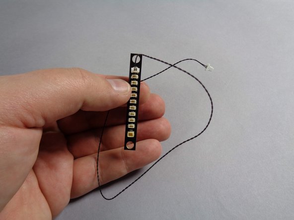 You should now have all small light plugs disconnected from the old BRANCH10 adapter board inside your Falcon.  Disconnect the black cable connecting the BRANCH10 adapter to the old TRUNK05 controller, and keep these parts for another lighting project.