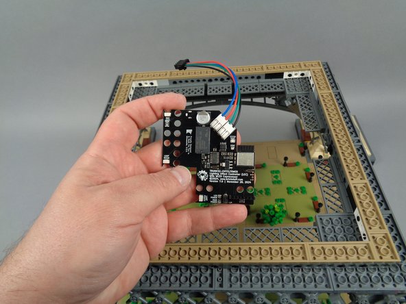 As shown in the photos for this step, take your main controller and connect the barrel plug from the power supply cable to the power input on the bottom of the controller board.