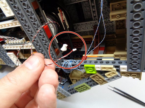 As shown in the second photo, take the small connector from the wire connected to the &quot;IN&quot; plug on the BRANCH17 adapter board and the large connector on the wire connected to the &quot;OUT&quot; plug, and run both wires under the castle and out the back as shown in the third photo.