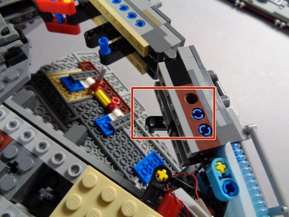 The red rectangles in the second and third photos show where the lever should be mounted.  Make sure it is mounted on the underside of the frame.