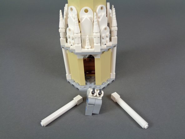 As shown in the second photo, remove the fireworks launcher and two white pillars from the outside of the tower front.