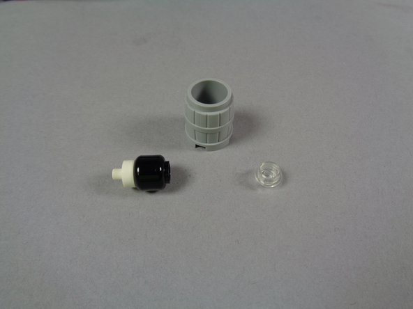 As shown in the second photo for this step, remove the internal parts from the barrel.