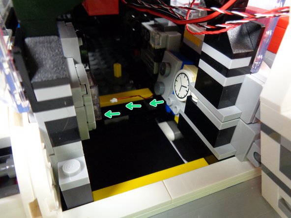 This is a tight space, so using a flashlight and tweezers to help feed the wires may help.