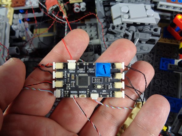 The third photo shows what your new TRUNK08 controller should look like with all wires and plugs connected.