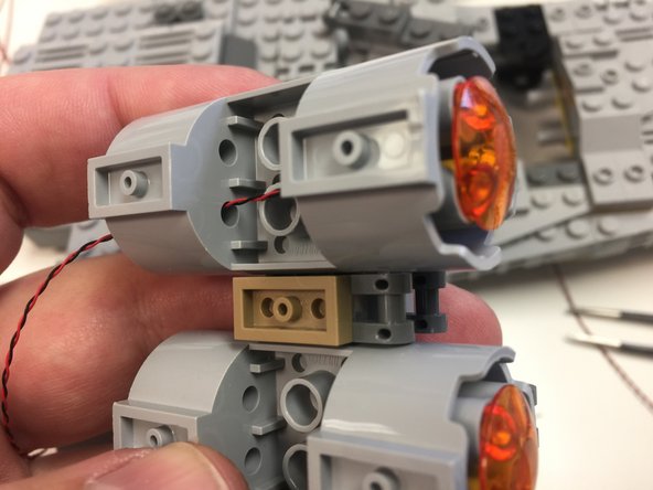 Depending on when your kit was manufactured, you will have one of three different designs of BRANCH10 adapter board: one with top-facing connectors (9 total small plugs), one with side-facing connectors and 10 total small plugs, or one with side-facing connectors and 12 total small plugs.  The operation of all three designs of board is identical.
