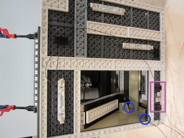 The second photo shows a feeder wire passing behind a spiral staircase from a higher floor.