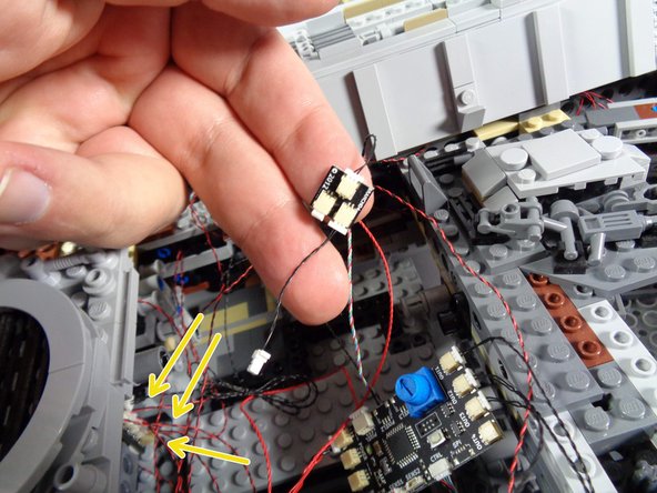 The yellow rectangle in the second photo shows this black wire as it may look inside your Falcon.