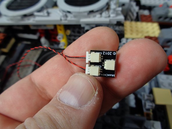 As shown in the first photo, connect the 2-wire power plug from the &quot;laser&quot; sound module to one of the other plugs on the BRANCH04/A4 adapter board.  This is the same adapter that the power wire from the &quot;engines&quot; sound module is already connected to.