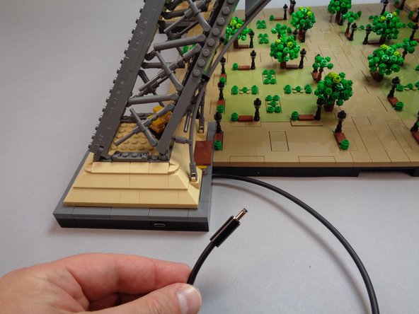 CAREFULLY turn your Eiffel Tower base back to its upright position.