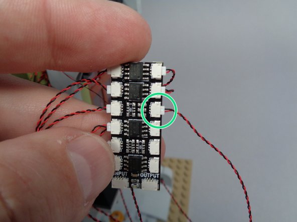 It does not matter which of the two sconces you connect to plug #8.