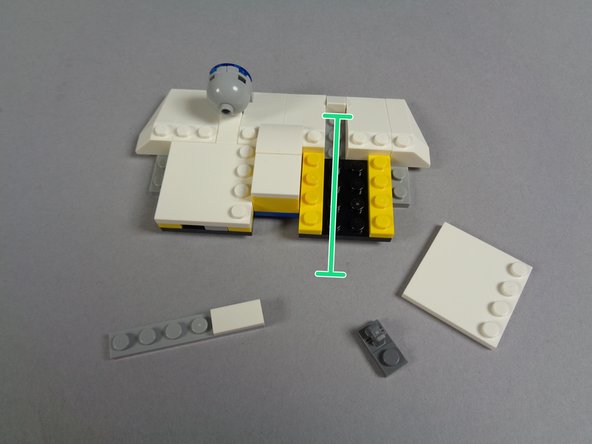 As shown by the orange arrows in the first photo, separate the top of the light from the dark bluish gray plate that it attaches to.