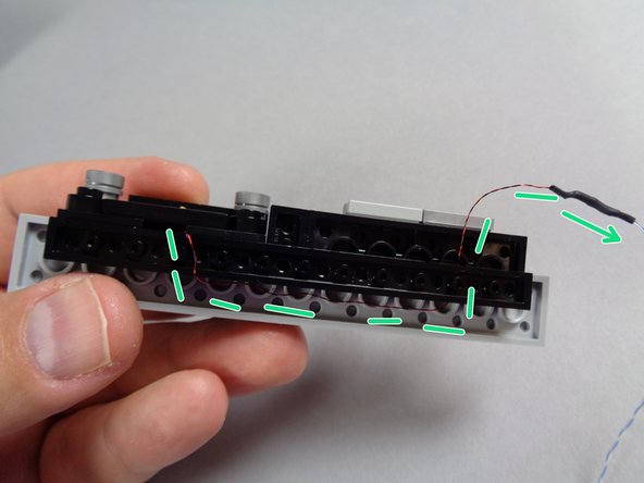 It is critical here that you make sure the wire passes between, not on top of, any studs.