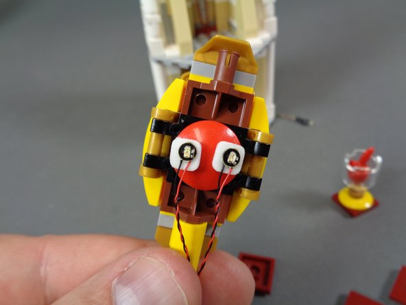 As shown by the yellow arrow in the first photo, you can tell the warm white light because it has a white background board, while the red and blue lights have black boards.