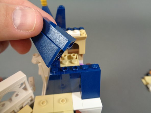 As shown in the first photo, remove the remaining blue roof pieces next on the left side of the bedroom.