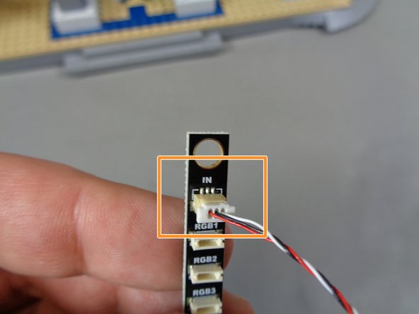 Also inside the &quot;Lower Level Lights and Parts&quot; bag, there will be a long adapter board labeled BRANCH17 on the back.  As shown by the orange rectangle in the second photo, connect the large end of the cable to the plug labeled &quot;IN&quot; on the BRANCH17 adapter board.