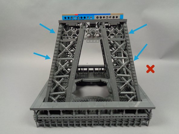 The yellow arrows in the first photo show how to correctly position your Tower's middle section.  The studs going down the side should be in the CENTER, and the EDGE should not have studs.