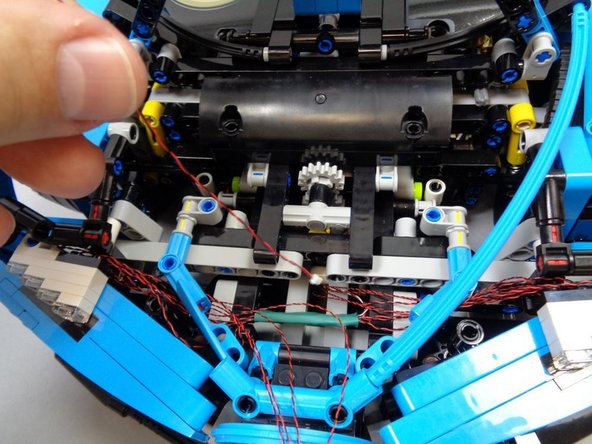 You can re-attach the RIGHT rear-view mirror you removed in Step 8.