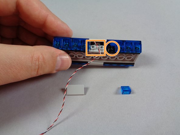 For the lightbar you plan to use at the front of your Ecto-1, complete the additional steps shown here to move the control wires off to the side of center.