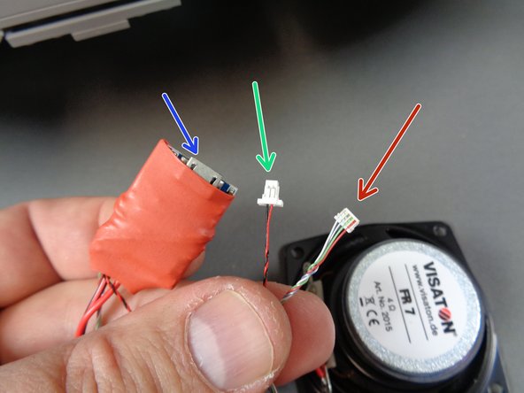 Next you will mount the &quot;laser&quot; sound module.  As shown in the first photo, the &quot;laser&quot; sound module has a 2-wire power connector (green arrow) and a 4-wire control connector (red arrow).