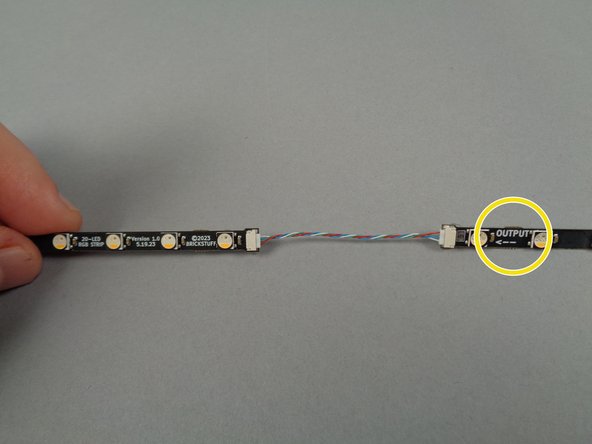As shown in the photos for this step, connect the 17-LED strips and the 20-LED strips together at the OUTPUT end of the 17-LED strips.