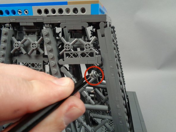 As shown by the red circle in the photo for this step, remove the small piece that supports the horizontal walkway.  This needs to be removed to make room for the light strip.