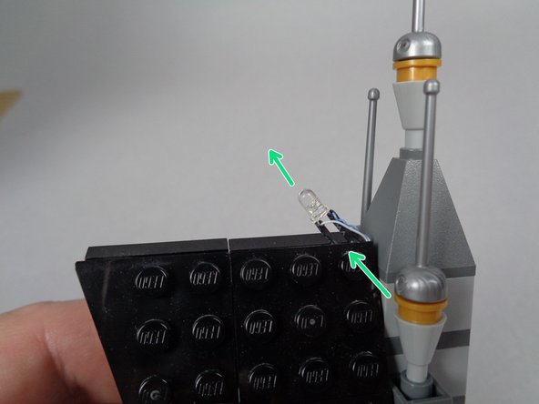 The second photo for this step shows the lightning LED light mounted after the roof piece has been re-attached.