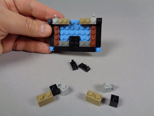 Finally, complete the disassembly of the bottom marquee section by removing these parts: