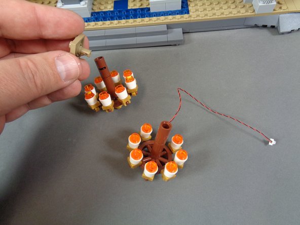 As shown in the second photo, remove your un-lit chandelier from its mount and transfer the parts (top mount, lower gold round plate) over to the pre-lit chandelier.