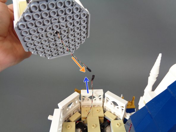 You will now re-attach the top tower section.