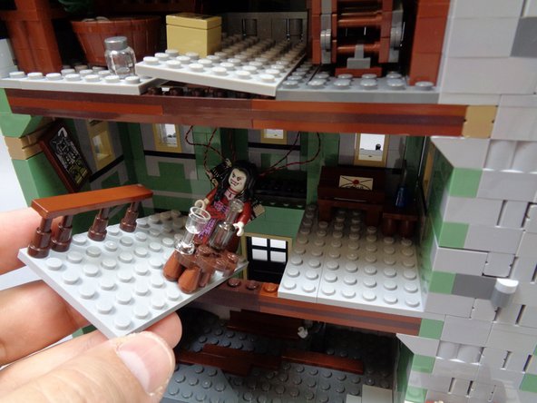 As shown in the first photo, remove the large center floor section from the second floor.